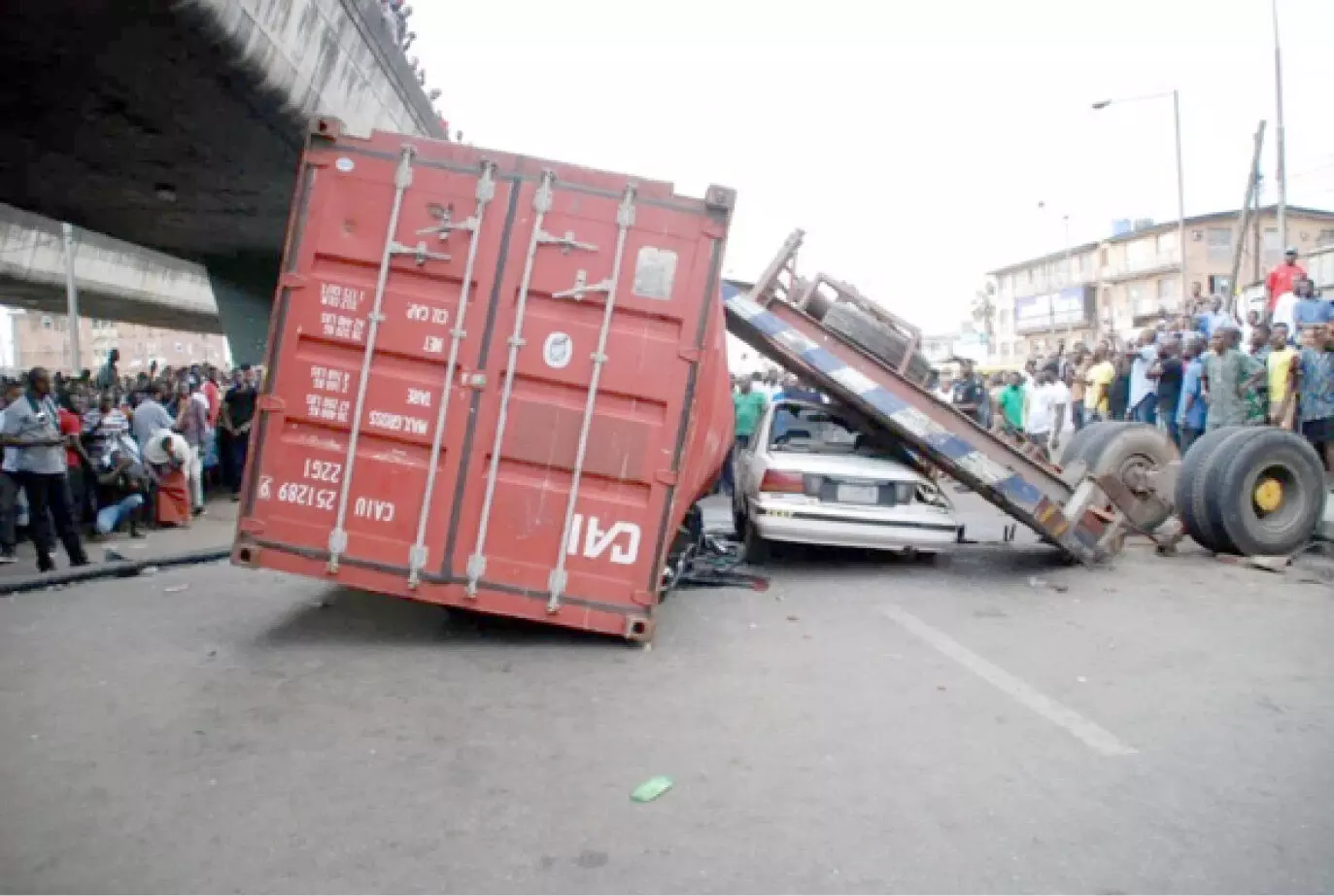 Falling container kills woman inside her car in Lagos traffic